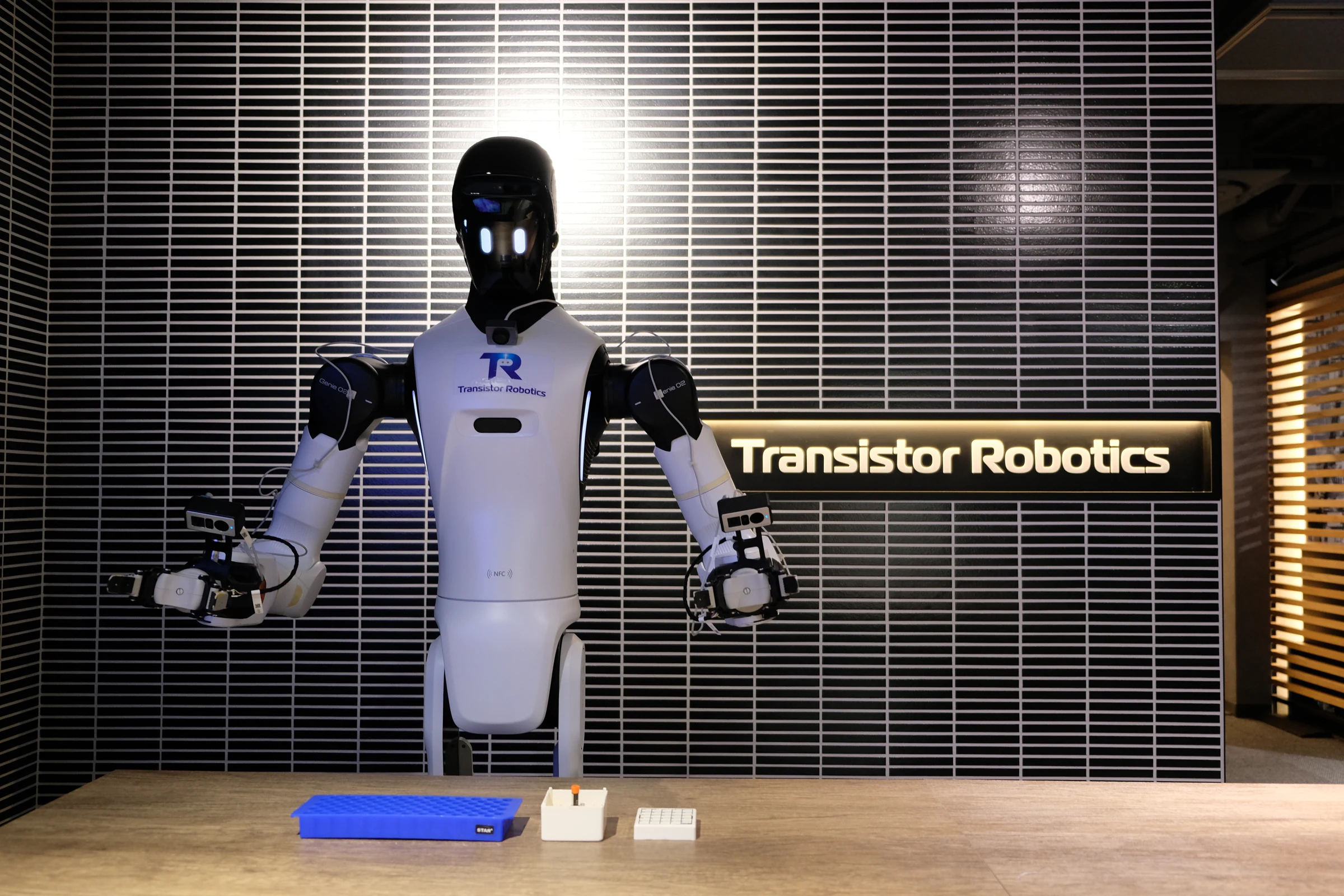 Humanoid robot performing a laboratory workflow at Transistor Robotics